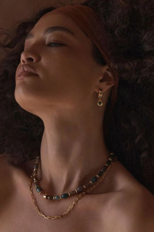 Alanya Earrings Green by Amber Sceats, sculptural gold hoops with Beryl Emeralds, a bold trendy style perfect for statement evenings.