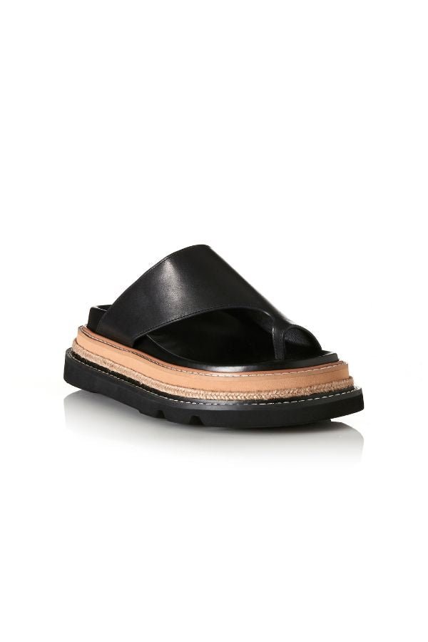Alias Mae Venetia Sandal in Black Leather, a sleek toe-loop design with chunky raffia-detailed sole for elevated summer style.
