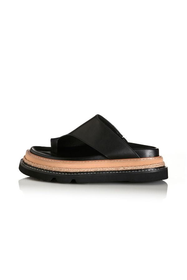 Alias Mae Venetia Sandal in Black Leather, a sleek toe-loop design with chunky raffia-detailed sole for elevated summer style.