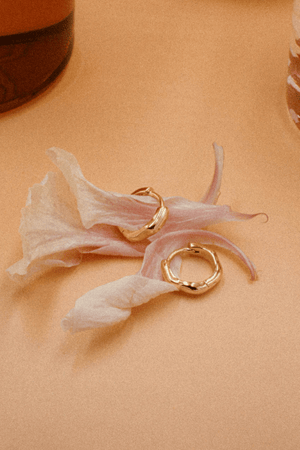 Alice Huggies by Avant Studio, gold huggie earrings with sleek minimal design. Perfect for everyday wear or layering looks.