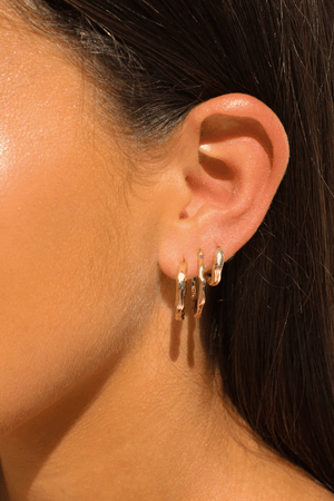 Alice Huggies by Avant Studio, gold huggie earrings with sleek minimal design. Perfect for everyday wear or layering looks.