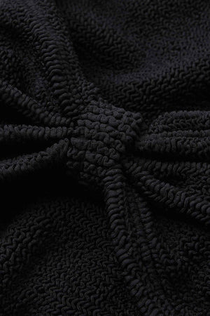 Alicia Bikini in Black by Hunza G, a trending bow-detail crinkle set with stretchy, flattering fit for chic beach days.