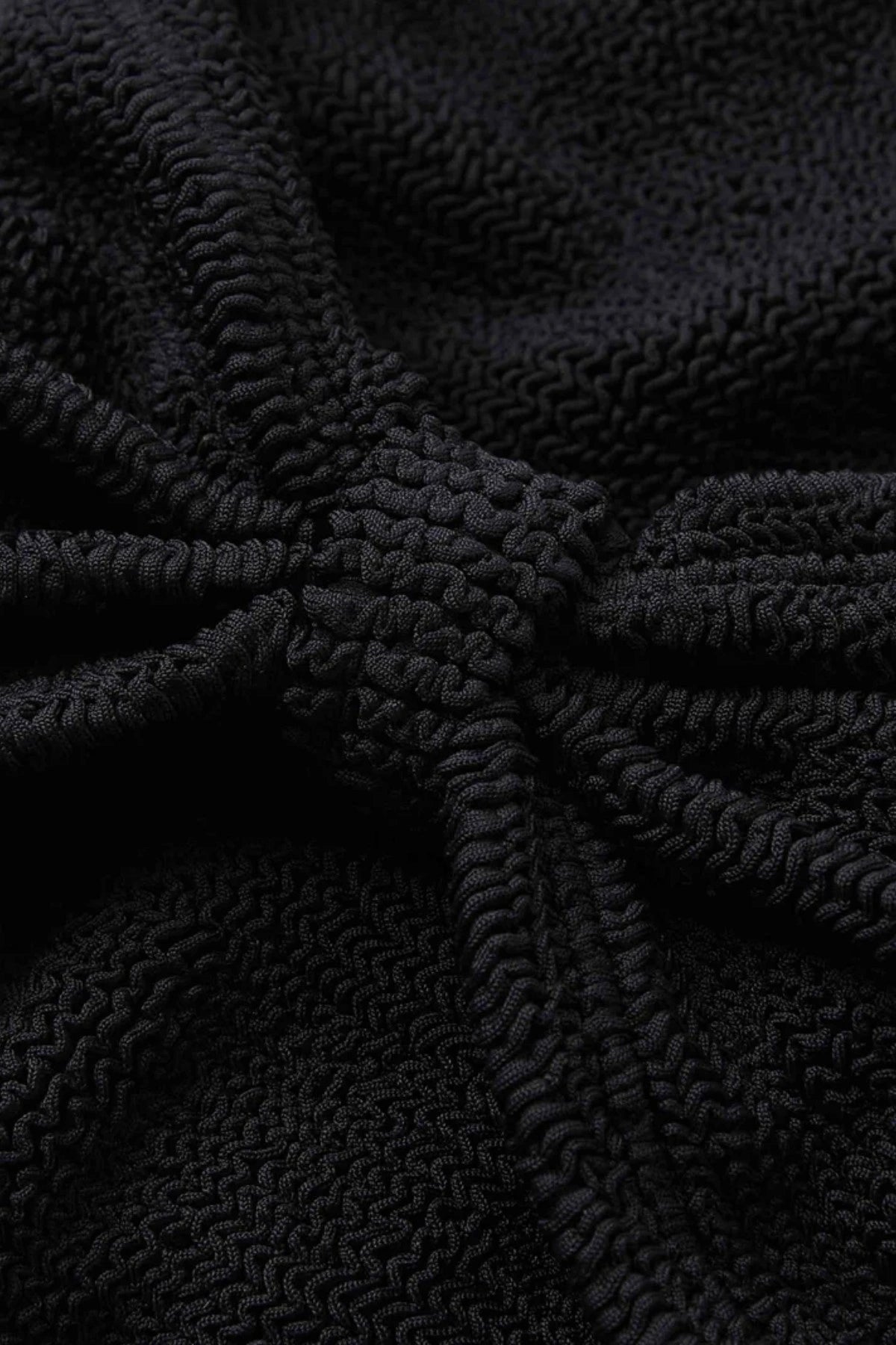 Alicia Bikini in Black by Hunza G, a trending bow-detail crinkle set with stretchy, flattering fit for chic beach days.