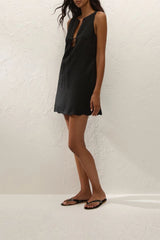 Alondra Mini Dress Black by Faithfull the Brand – a linen mini dress with tie detail and scalloped hem. Perfect for summer styling.