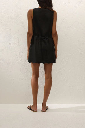 Alondra Mini Dress Black by Faithfull the Brand – a linen mini dress with tie detail and scalloped hem. Perfect for summer styling.