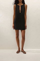 Alondra Mini Dress Black by Faithfull the Brand – a linen mini dress with tie detail and scalloped hem. Perfect for summer styling.