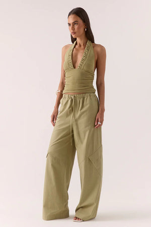 Alora Top Soft Olive by Sovere – halter mesh top with gathered details and back tie. Perfect for summer nights or elevated casual looks.