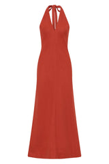 Amara Midi Dress by Faithfull the Brand — a dusty tomato linen halter dress with an open back and flowing bias-cut skirt, perfect for warm vacations.