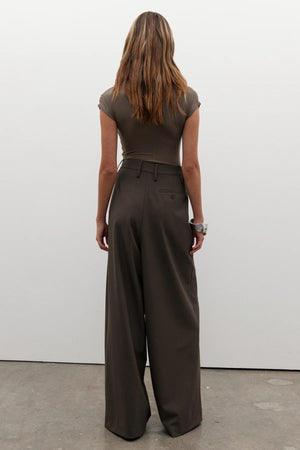 Amrita Sleeveless Bodysuit in Mink by Bayse, crafted from a soft stretch-knit blend for a sleek, comfortable fit. Ideal for layering.
