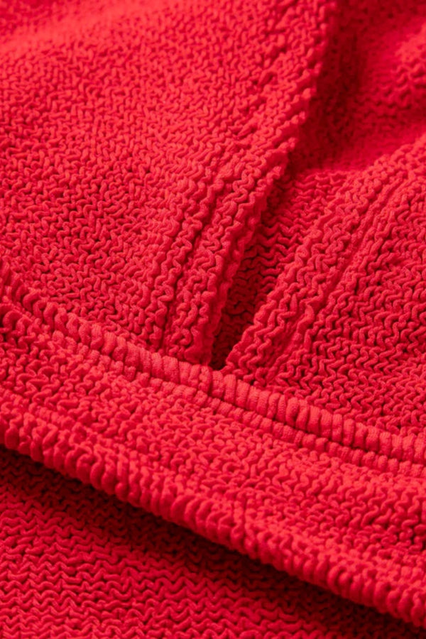 Angel Bikini in Red by Hunza G, supportive underband top and V-waist bottoms in metallic crinkle fabric. Perfect for confident summer days.