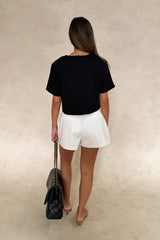Anna Top Black by Sneaky Link – a cropped boxy top with V neckline and structured fit. Perfect for modern everyday styling.