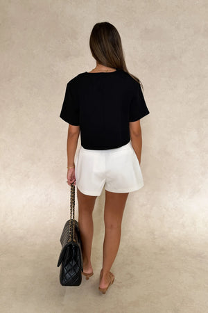 Anna Top Black by Sneaky Link – a cropped boxy top with V neckline and structured fit. Perfect for modern everyday styling.