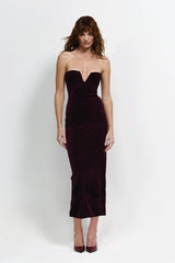 Annora Dress in Wine by Effie Kats, a strapless velvet dress with plunging V-neckline, cinched waist, and mid-length hem for a bold, elegant look.