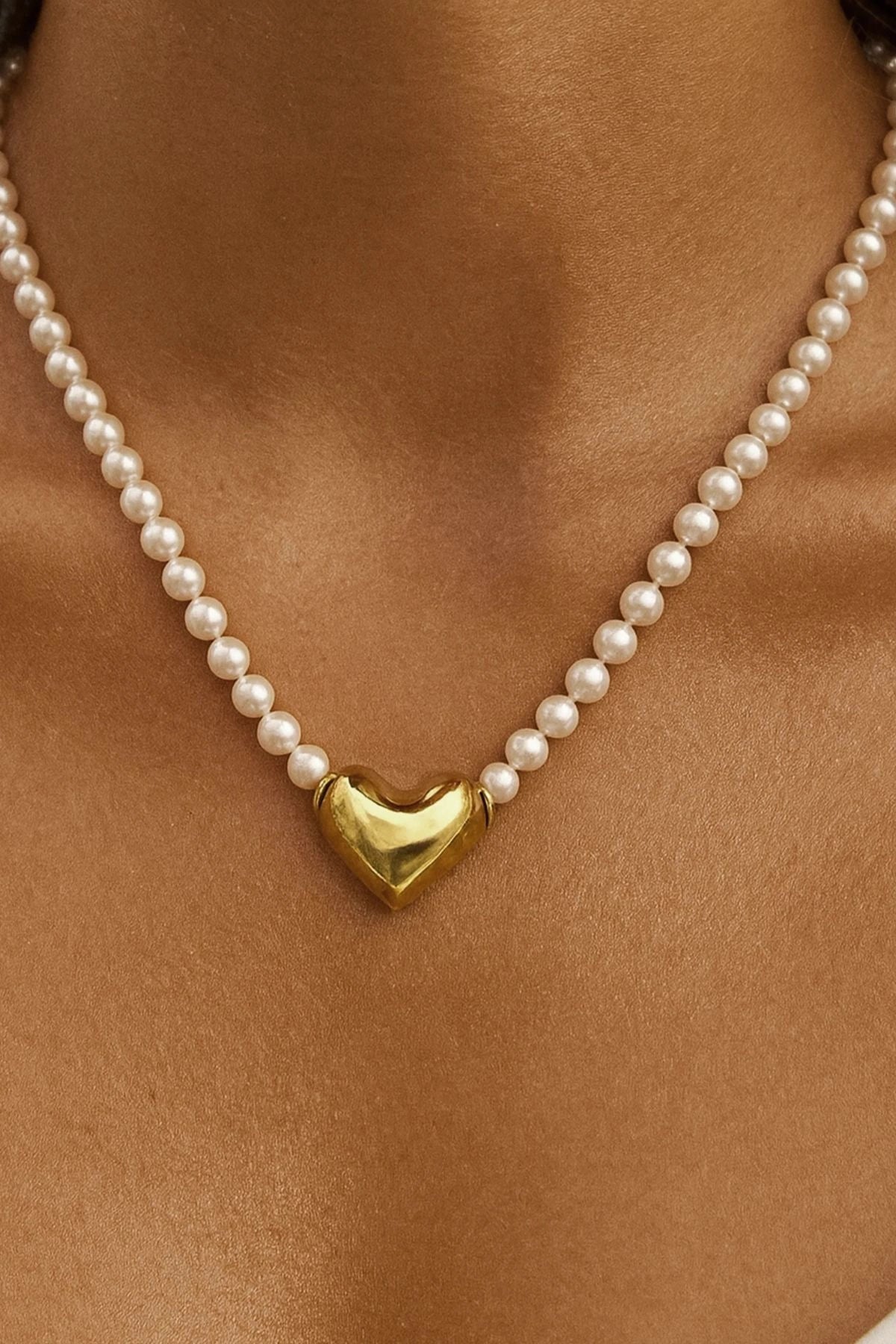 Anouk Pearl Heart Choker by Avant Studio, 6mm South China Sea pearls with a sculptural gold heart clasp. Elegant, romantic, and timeless.