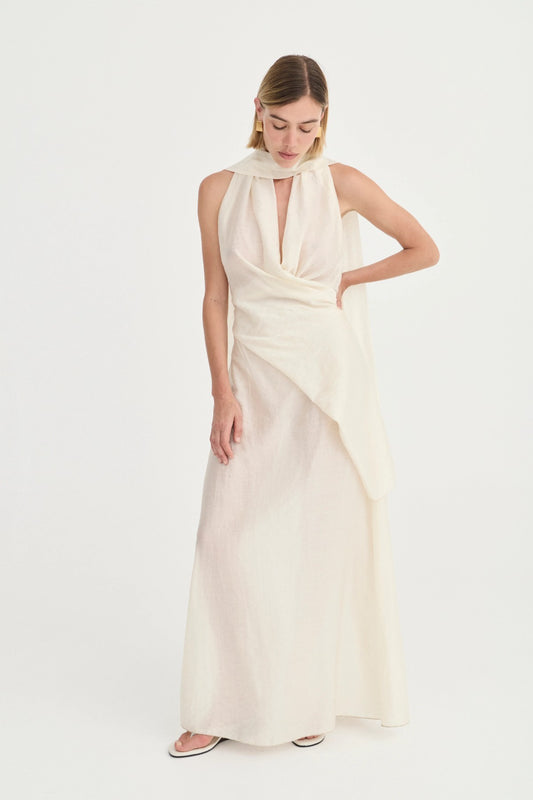 Antonella Dress Ivory Leaf by Solaqua – halter maxi dress with wrap bodice and fluid floor-length skirt.