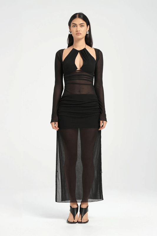 Ari Cutaway Dress Black by Benni – A viral, sleek maxi with dramatic geometric cut-outs and adjustable leg slits, perfect for bold, glamorous nights.
