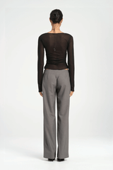 Ari Cutaway Top Black by Benni — Sculptural high-stretch mesh top with geometric cut-out halter neckline, long sleeves, adjustable tie, and built-in shelf bra.