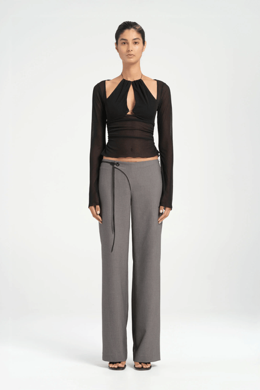 Ari Cutaway Top Black by Benni — Sculptural high-stretch mesh top with geometric cut-out halter neckline, long sleeves, adjustable tie, and built-in shelf bra.