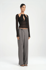 Ari Cutaway Top Black by Benni — Sculptural high-stretch mesh top with geometric cut-out halter neckline, long sleeves, adjustable tie, and built-in shelf bra.