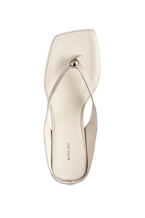 Aria Bone Oil Leather by Alias Mae, leather thong sandal with stud detail and 6cm curved heel, a trendy piece perfect for summer or polished styling.