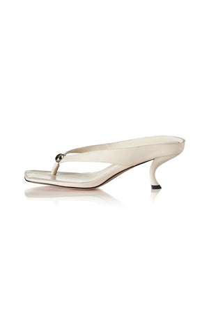Aria Bone Oily Leather by Alias Mae, leather thong sandal with stud detail and 6cm curved heel, a trendy piece perfect for summer or polished styling.