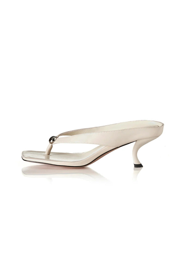 Aria Bone Oily Leather by Alias Mae, leather thong sandal with stud detail and 6cm curved heel, a trendy piece perfect for summer or polished styling.