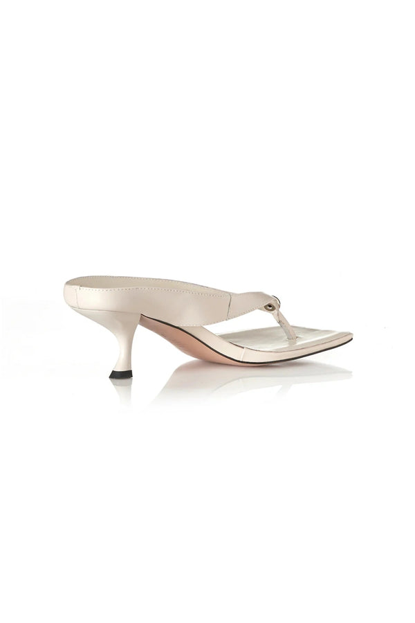 Aria Bone Oily Leather by Alias Mae, leather thong sandal with stud detail and 6cm curved heel, a trendy piece perfect for summer or polished styling.