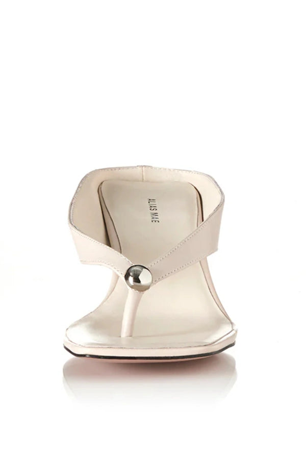 Aria Bone Oily Leather by Alias Mae, leather thong sandal with stud detail and 6cm curved heel, a trendy piece perfect for summer or polished styling.