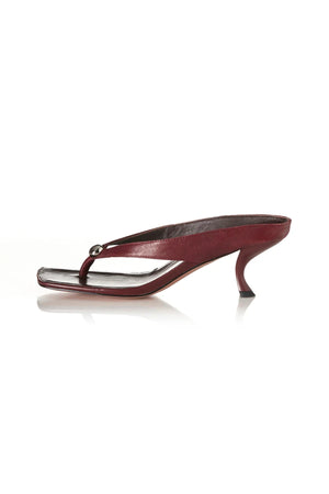 Aria Burgundy Oily Leather by Alias Mae, thong sandal with stud accents and 6cm curved heel, a trendy piece perfect for everyday chic or evenings out.