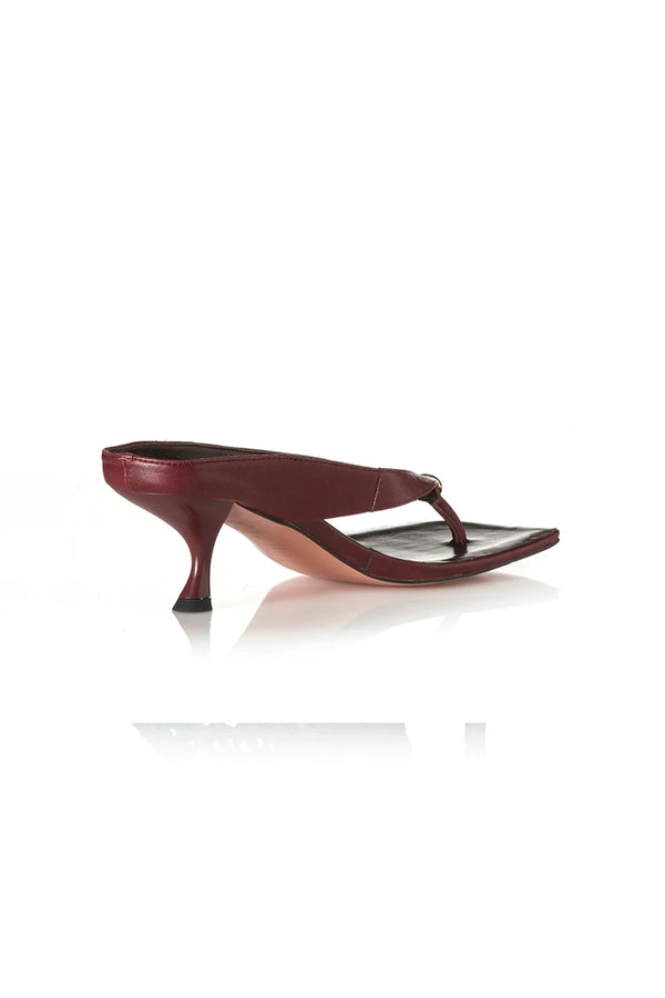 Aria Burgundy Oily Leather by Alias Mae, thong sandal with stud accents and 6cm curved heel, a trendy piece perfect for everyday chic or evenings out.
