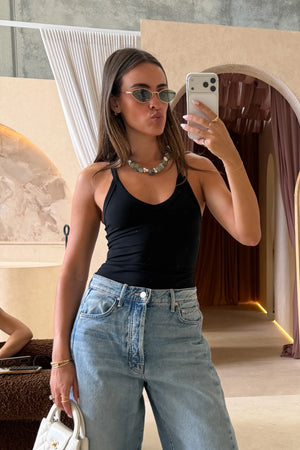 Aria Tank Black by Sneaky Link – a sculpting stretch tank with smooth seamless feel. Perfect for flattering everyday wear.