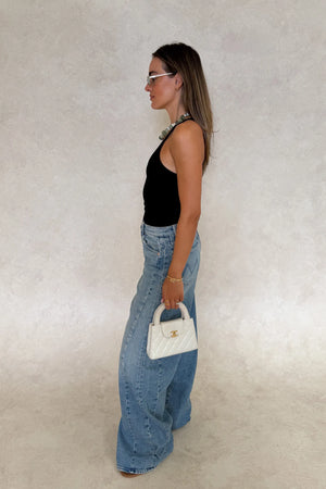 Aria Tank Black by Sneaky Link – a sculpting stretch tank with smooth seamless feel. Perfect for flattering everyday wear.