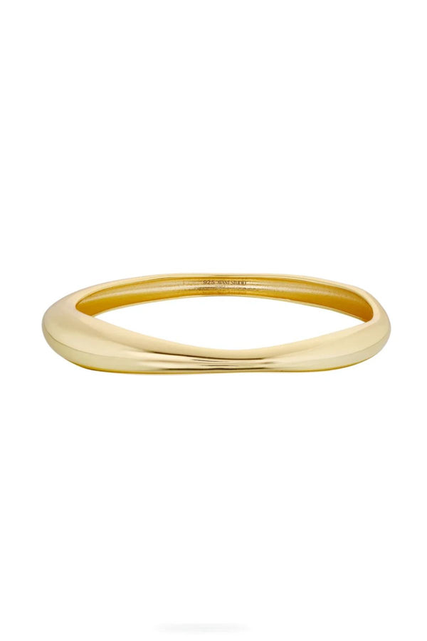 Cristabel Bangle by Avant Studio, a 5mm gold oval bangle with organic shape. Perfect for layering or everyday elegant wear.