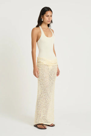 Ariel Maxi Dress Marshmallow by Benni, scoop-neck stretch bodysuit with racerback and cascading sequin cowl skirt for sleek, shimmering elegance.