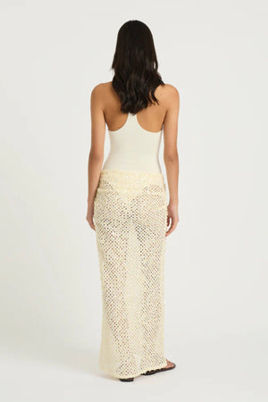 Ariel Maxi Dress Marshmallow by Benni, scoop-neck stretch bodysuit with racerback and cascading sequin cowl skirt for sleek, shimmering elegance.