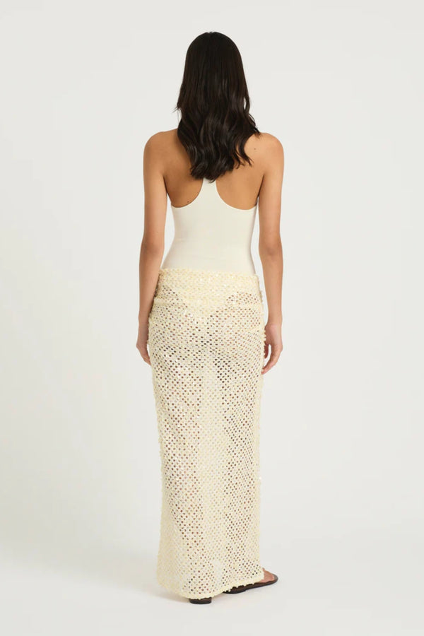 Ariel Maxi Dress Marshmallow by Benni, scoop-neck stretch bodysuit with racerback and cascading sequin cowl skirt for sleek, shimmering elegance.