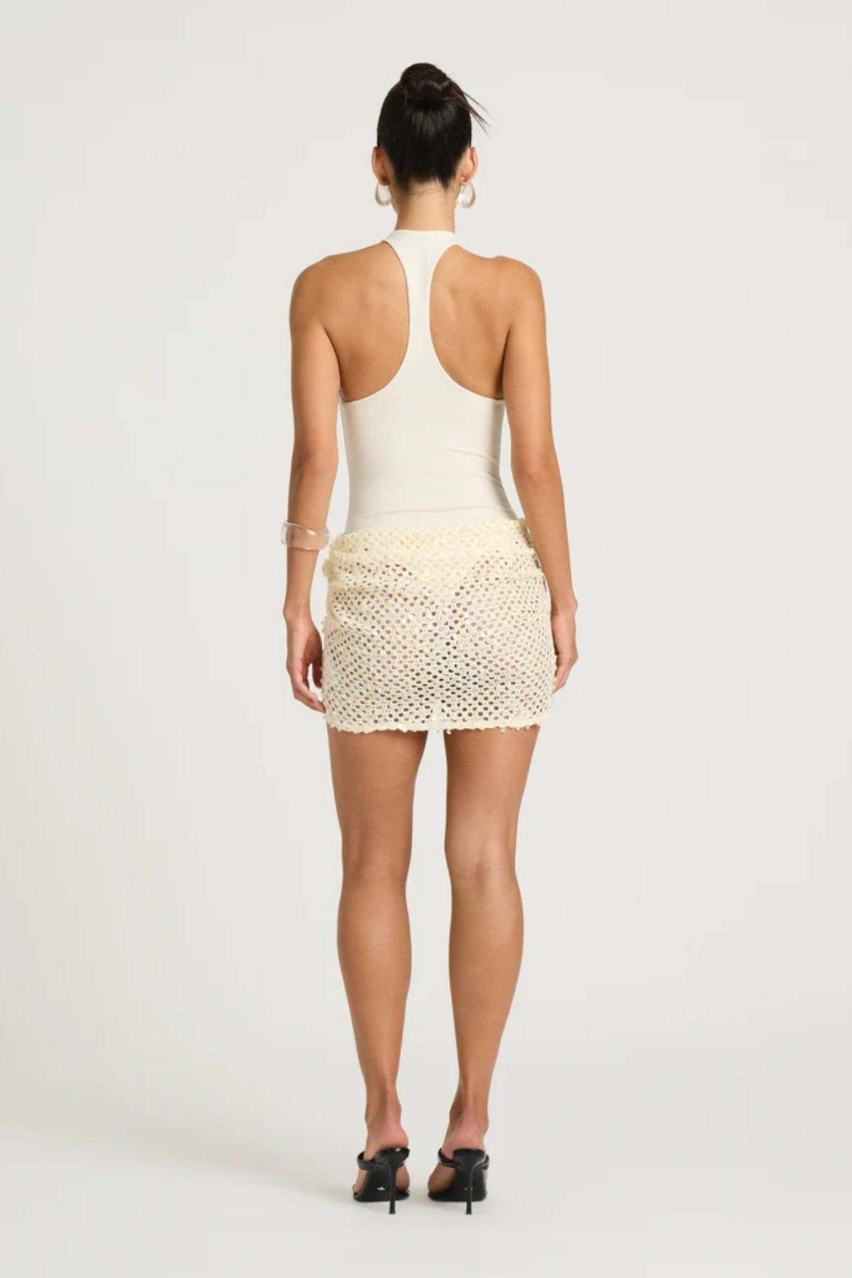 Ariel Mini Dress in Shell by Benni – scoop-neck bodysuit with racerback and draped cowl sequin skirt, a sleek statement party mini.