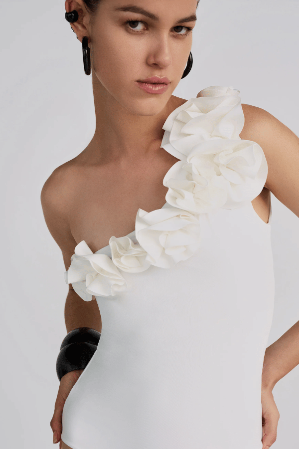 Arrebol One Piece Off White by Maygel Coronel, ruched swimsuit with floral detail and neck strap. Perfect for beach days or elegant swim looks.