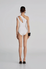 Arrebol One Piece Off White by Maygel Coronel, ruched swimsuit with floral detail and neck strap. Perfect for beach days or elegant swim looks.