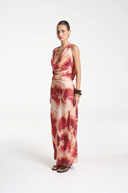 Ash Maxi Dress by Summi Summi — a bias-cut Aloha-print maxi with a cowl neckline and low tie-back, perfect for elegant warm-weather styling.