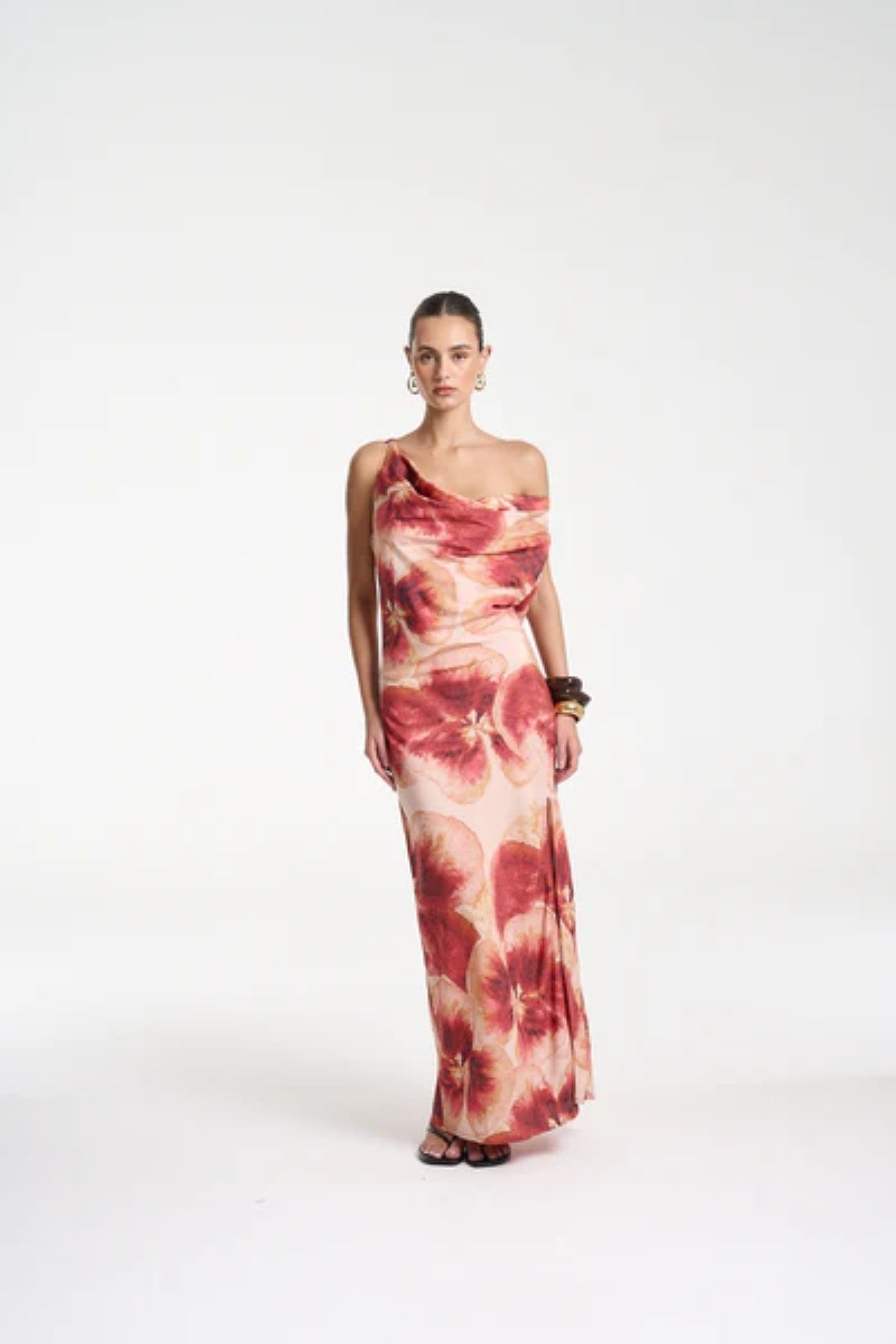 Ash Maxi Dress by Summi Summi — a bias-cut Aloha-print maxi with a cowl neckline and low tie-back, perfect for elegant warm-weather styling.