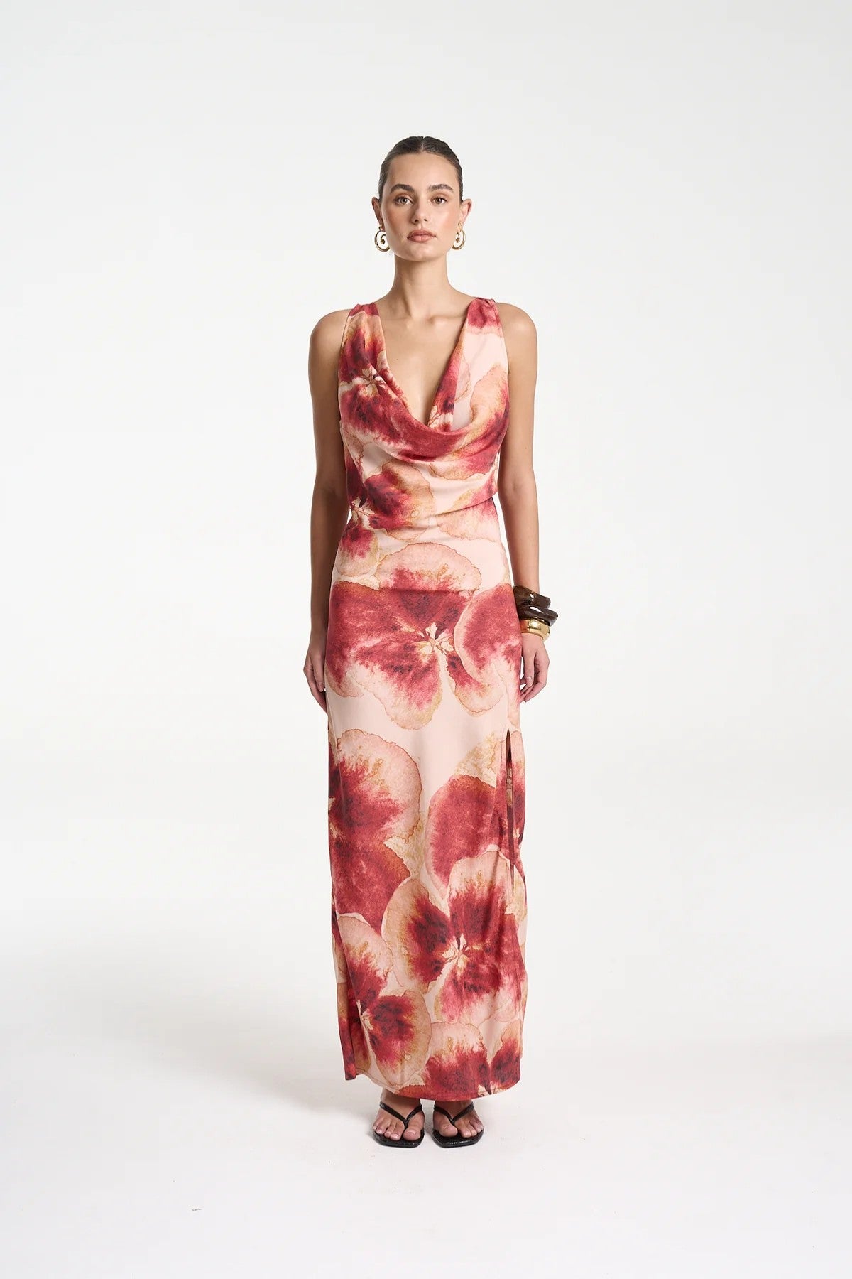 Ash Maxi Dress by Summi Summi — a bias-cut Aloha-print maxi with a cowl neckline and low tie-back, perfect for elegant warm-weather styling.