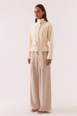 Asha Jacket Pannacotta by Sovere – relaxed cotton jacket with stand collar and adjustable belt detailing.