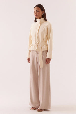 Asha Jacket Pannacotta by Sovere – relaxed cotton jacket with stand collar and adjustable belt detailing.