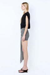 Astra Drape Mini Skirt by Bec + Bridge, a shimmering embellished knit mini with asymmetric gathers and a draped sash—perfect for chic summer styling.