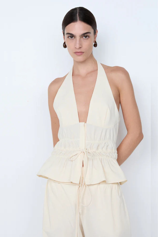 Astrid Halter Top by Bec and Bridge – an ivory halter top with a gathered waist and adjustable drawstring, perfect for polished holiday styling.