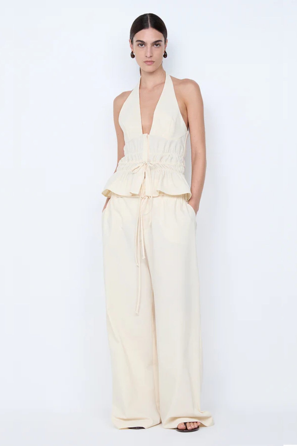 Astrid Wide Leg Pant by Bec + Bridge, a soft ecru tailored pant with faux drawstring detail and relaxed wide-leg fit for refined summer styling.