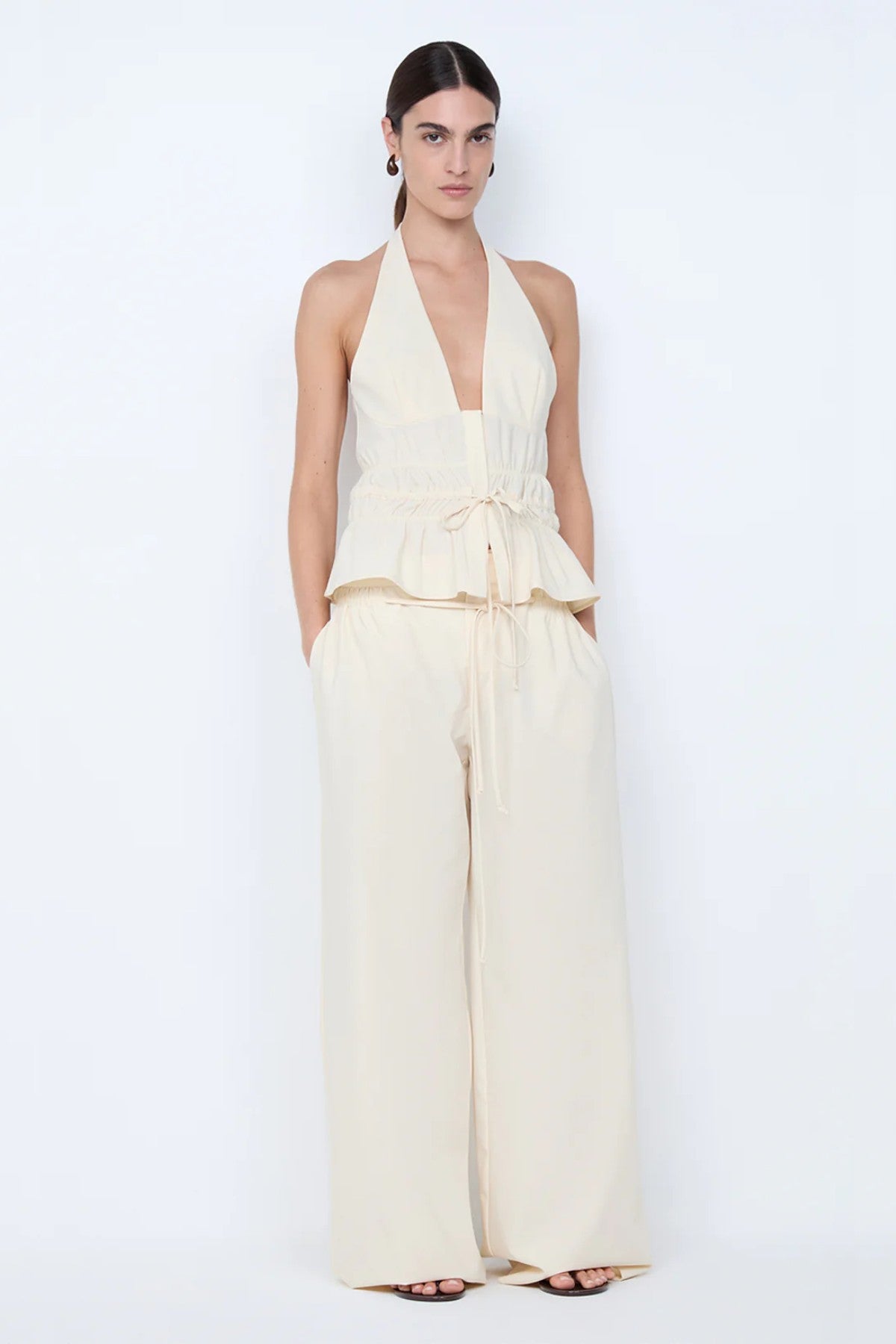 Astrid Wide Leg Pant by Bec + Bridge, a soft ecru tailored pant with faux drawstring detail and relaxed wide-leg fit for refined summer styling.