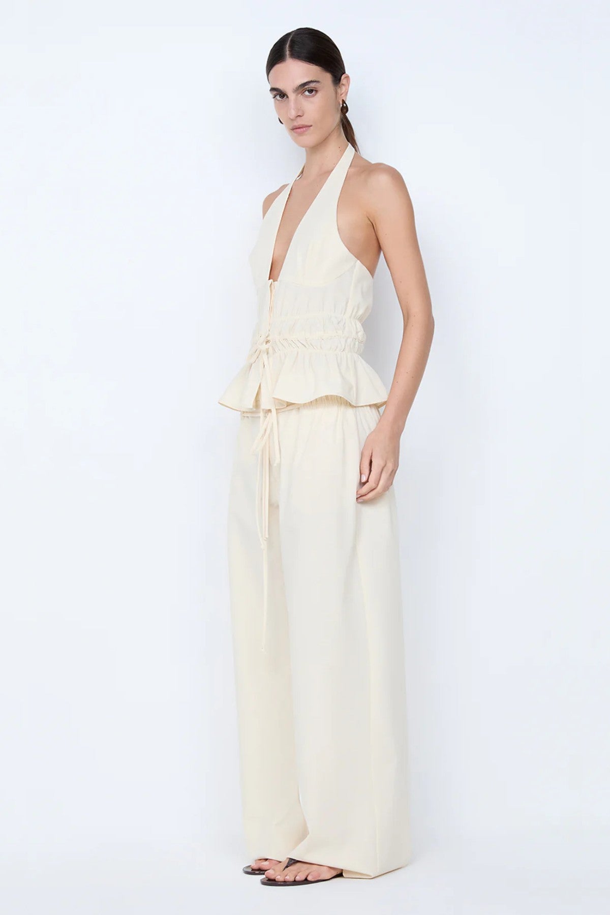 Astrid Wide Leg Pant by Bec + Bridge, a soft ecru tailored pant with faux drawstring detail and relaxed wide-leg fit for refined summer styling.