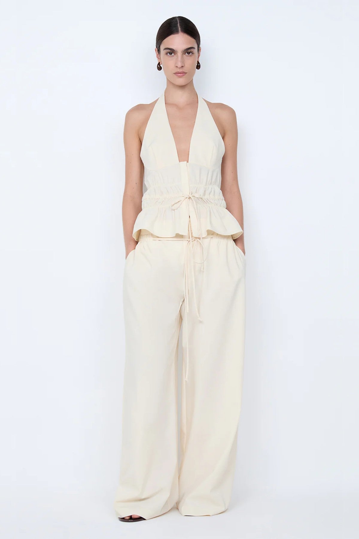 Astrid Wide Leg Pant by Bec + Bridge, a soft ecru tailored pant with faux drawstring detail and relaxed wide-leg fit for refined summer styling.